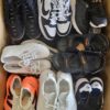 The photo shows a package with footwear in the category SH.