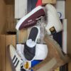 The photo shows a package with footwear in the category AS.