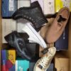 The photo shows a package with footwear in the category AS.