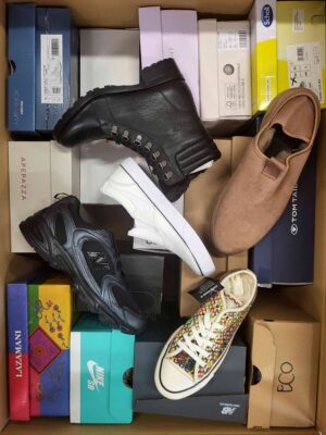 The photo shows a package with footwear in the category AS.
