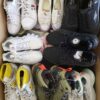 The photo shows a package with footwear in the category SH.