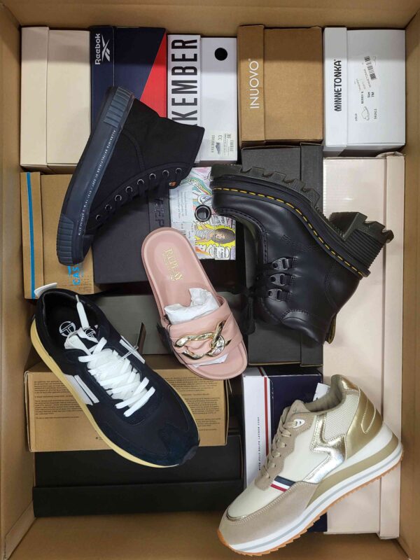 The photo shows a package with footwear in the category AS.