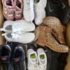 The photo shows a package with footwear in the category SH.