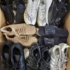 The photo shows a package with footwear in the category SH.