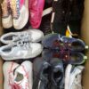 The photo shows a package with footwear in the category SH.