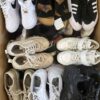 The photo shows a package with footwear in the category SH.