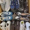 The photo shows a package with footwear in the category SH.