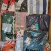 The photo shows a package with clothing in the category H.