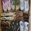 The photo shows a package with footwear in the category SH.