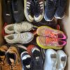 The photo shows a package with footwear in the category SH.