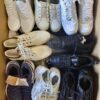 The photo shows a package with footwear in the category SH.