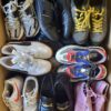 The photo shows a package with footwear in the category SH.