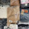 The photo shows a package with clothing in the category D.