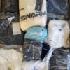 The photo shows a package with clothing in the category D.