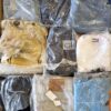 The photo shows a package with clothing in the category D.