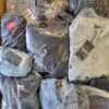 The photo shows a package with clothing in the category D.