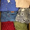 The photo shows a package with clothing in the category U.