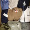 The photo shows a package with clothing in the category U.