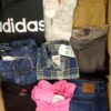 The photo shows a package with clothing in the category U.