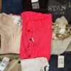 The photo shows a package with clothing in the category U.