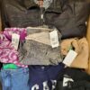 The photo shows a package with clothing in the category U.