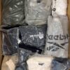 The photo shows a package with clothing in the category D.