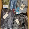 The photo shows a package with clothing in the category AJS.