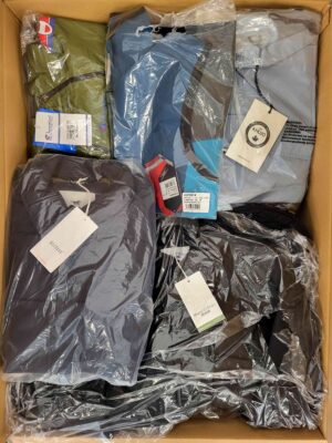 The photo shows a package with clothing in the category AJS.