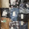 The photo shows a package with clothing in the category AW.
