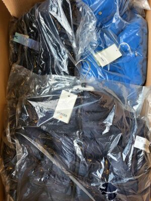 The photo shows a package with clothing in the category AJW.