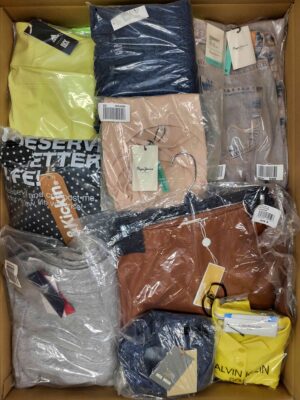The photo shows a package with clothing in the category AW.