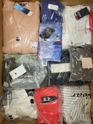 The photo shows a package with clothing in the category AW.