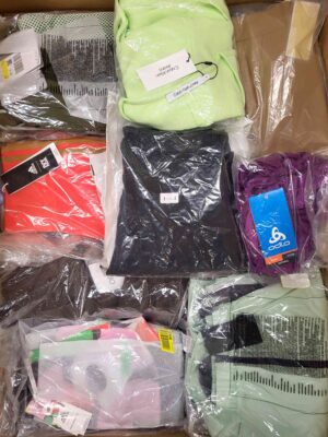 The photo shows a package with clothing in the category AW.