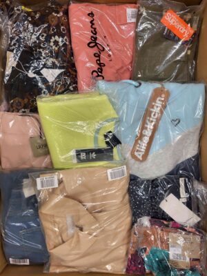The photo shows a package with clothing in the category AW.