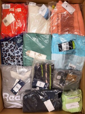 The photo shows a package with clothing in the category AW.