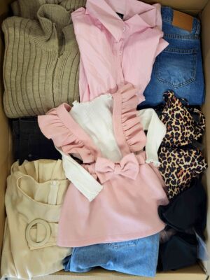 The photo shows a package with clothing in the category BSN.