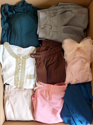 The photo shows a package with clothing in the category BSN.