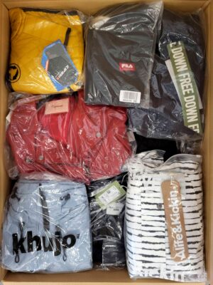 The photo shows a package with clothing in the category AJS.