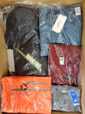 The photo shows a package with clothing in the category AJS.