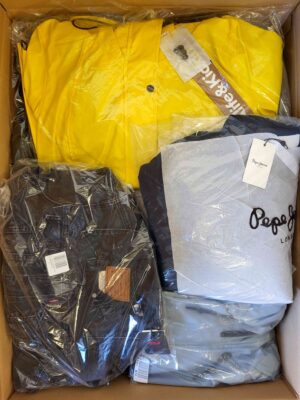 The photo shows a package with clothing in the category AJS.