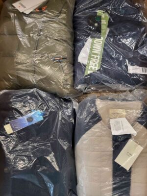 The photo shows a package with clothing in the category AJW.