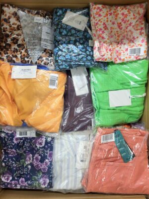 The photo shows a package with clothing in the category AR.