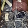 The photo shows a package with clothing in the category AJW.