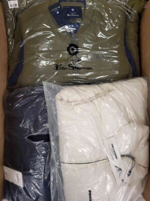 The photo shows a package with clothing in the category AJW.