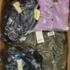 The photo shows a package with clothing in the category AJW.