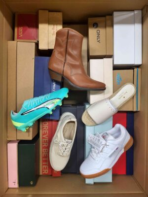 The photo shows a package with footwear in the category AS.