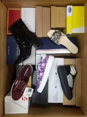 The photo shows a package with footwear in the category AS.