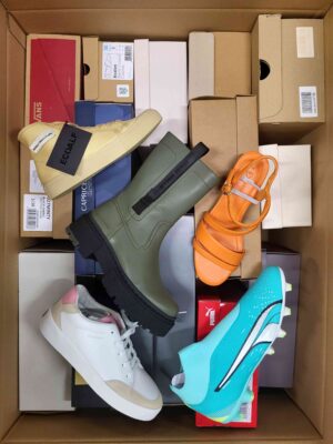 The photo shows a package with footwear in the category AS.