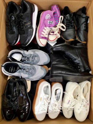 The photo shows a package with footwear in the category SH.