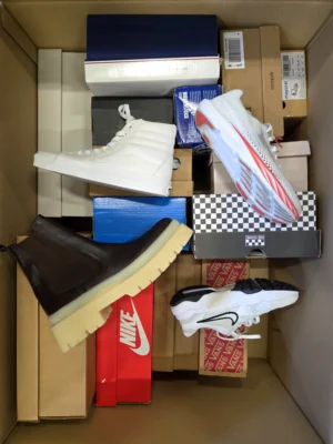 The photo shows a package with footwear in the category BS.